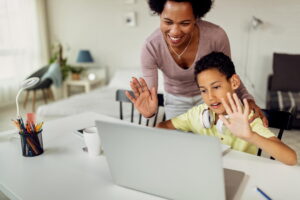 A Parent Guiding a Kid on How to Make Money Online